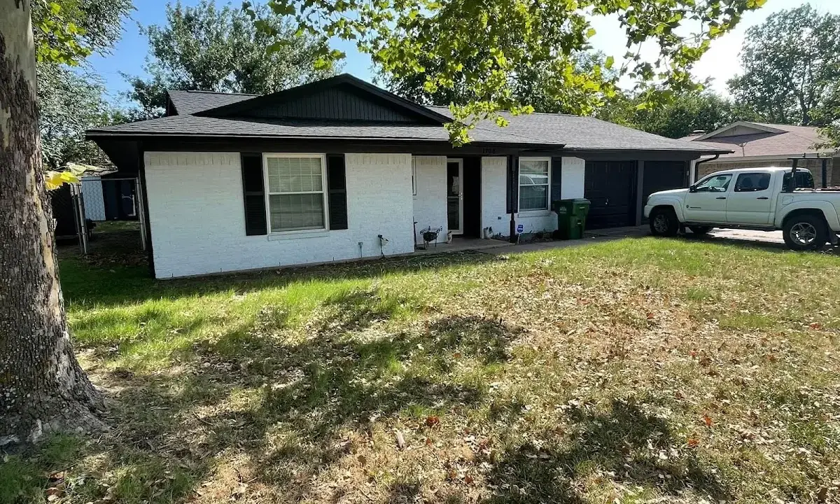 Professional roofing crew working on a residential roof in Waycross
