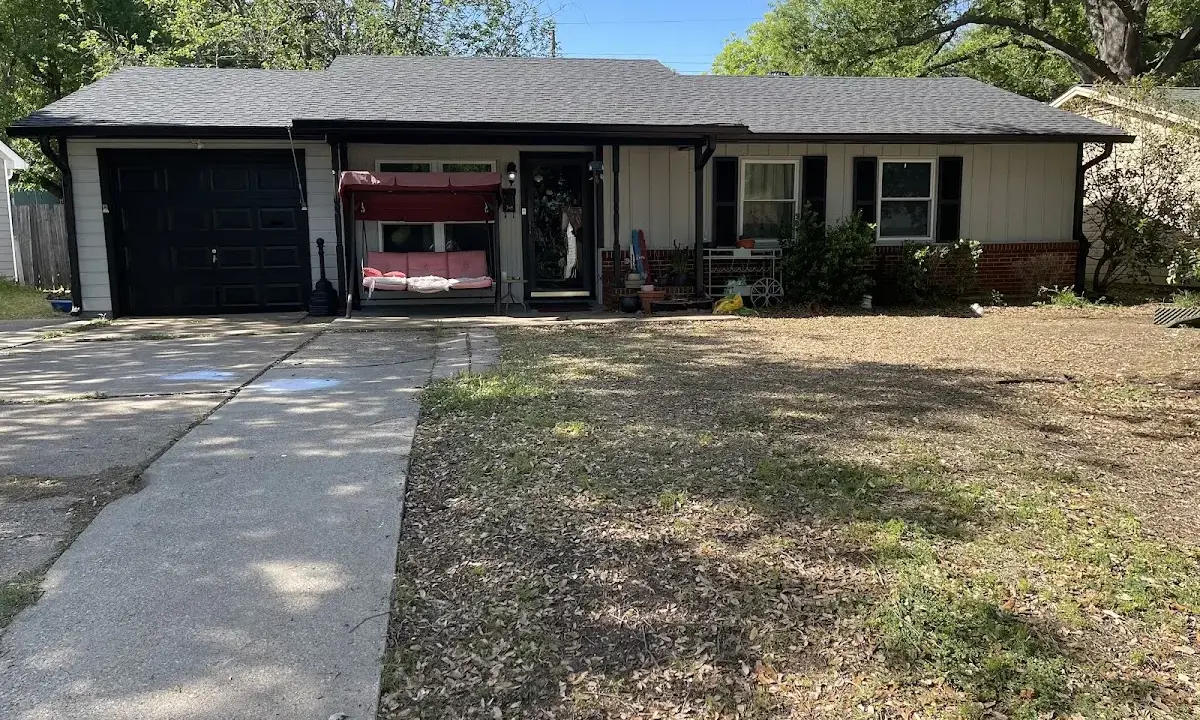 Wind Damage Roof Repair crew at work on a residential roof in Waycross